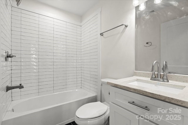 bathroom featuring shower / bath combination, vanity, and toilet