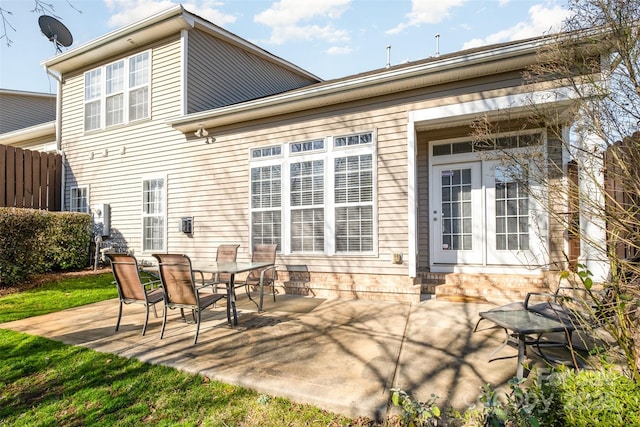 rear view of house with a patio and french doors