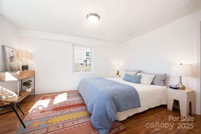 bedroom with wood finished floors