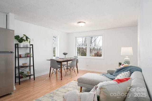 office space featuring light wood-style floors and baseboards