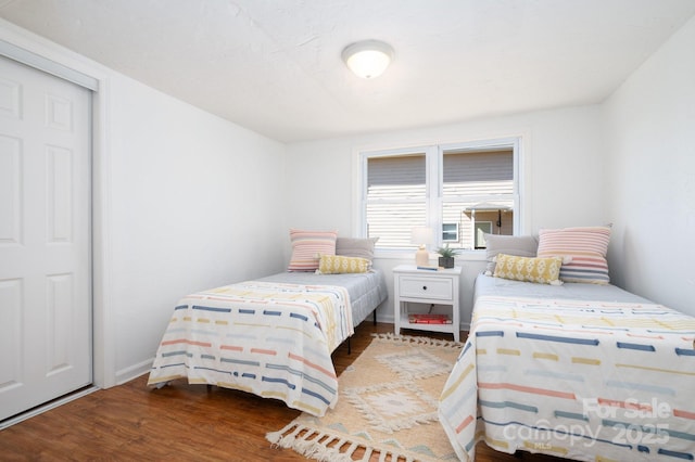 bedroom with wood finished floors