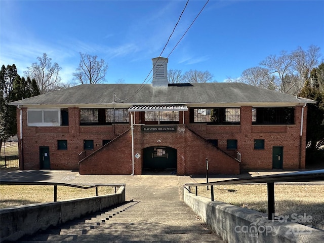 view of property featuring stairway