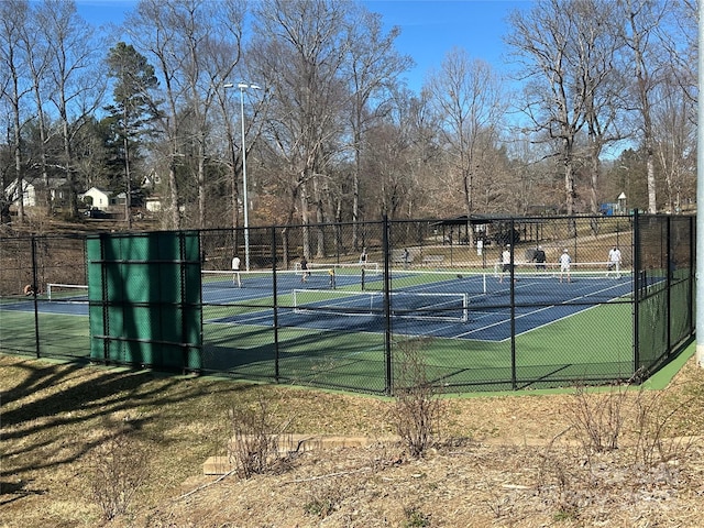 view of sport court with fence