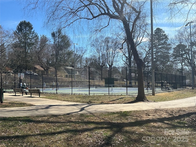 view of sport court with fence