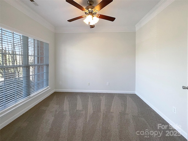 carpeted spare room featuring ceiling fan and crown molding