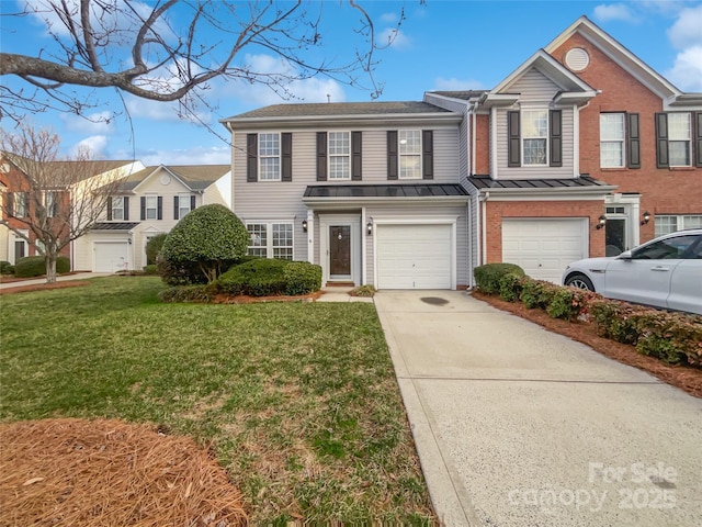 view of front of property with a front lawn and a garage