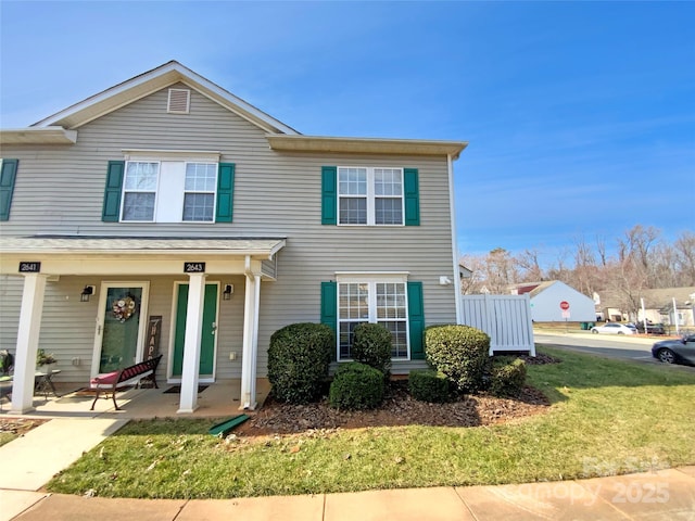 view of front of home featuring a front lawn and a porch