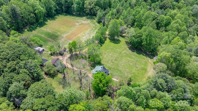 bird's eye view featuring a forest view and a rural view