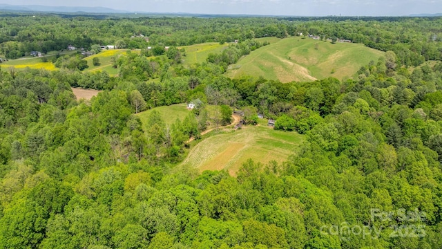 drone / aerial view with a view of trees