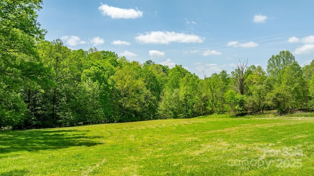 view of landscape with a view of trees