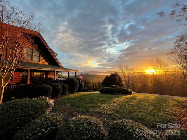 202 Panorama Dr, Nebo, NC 28761 - yard at dusk featuring covered porch and a yard