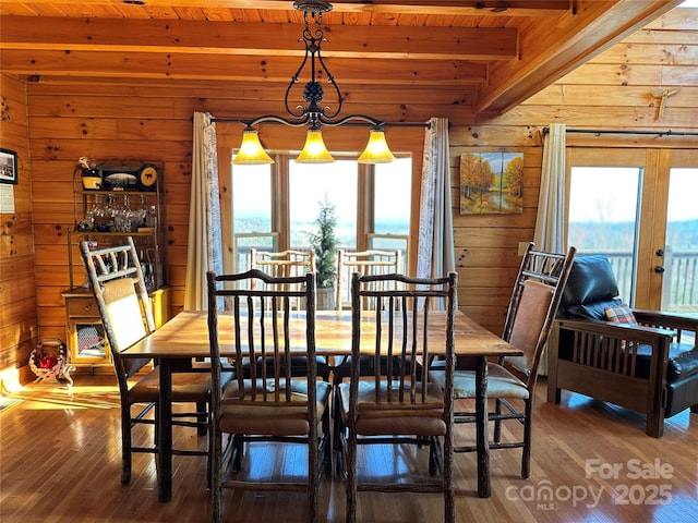 202 Panorama Dr, Nebo, NC 28761 - dining area with wood walls, beamed ceiling, plenty of natural light, wood ceiling, and hardwood / wood-style flooring
