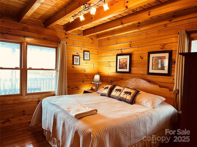 202 Panorama Dr, Nebo, NC 28761 - bedroom with beam ceiling, wood walls, hardwood / wood-style floors, wood ceiling, and rail lighting