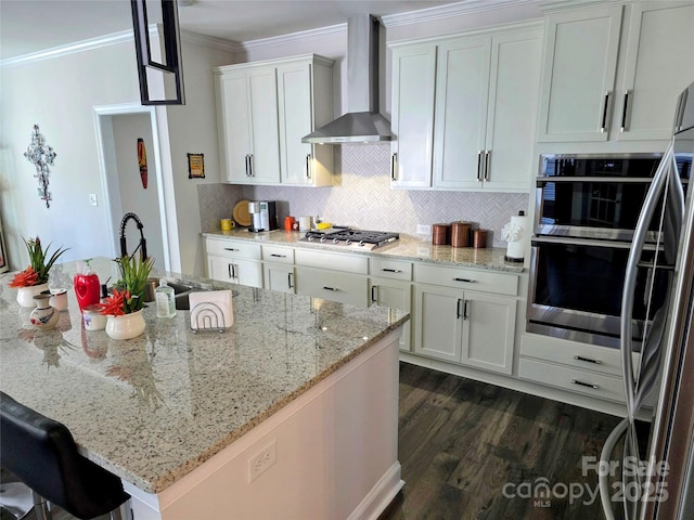 2617 Manor Stone Way, Indian Trail, NC 28079 - kitchen with dark wood-style floors, wall chimney range hood, crown molding, decorative backsplash, and appliances with stainless steel finishes