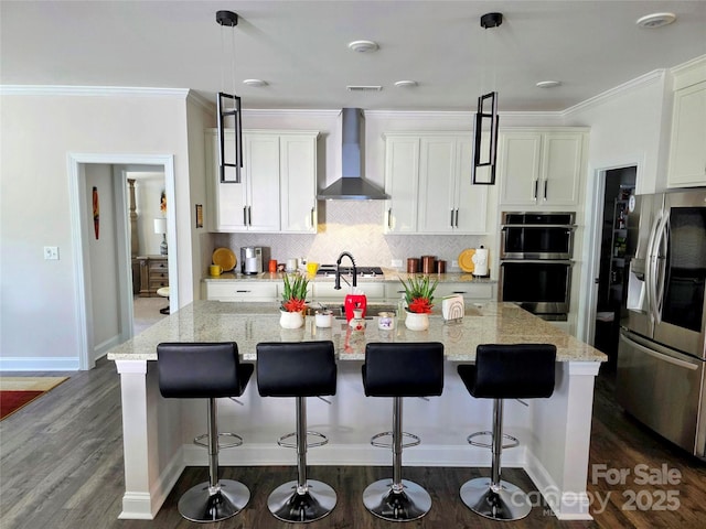 2617 Manor Stone Way, Indian Trail, NC 28079 - kitchen with crown molding, an island with sink, wall chimney exhaust hood, stainless steel appliances, and backsplash