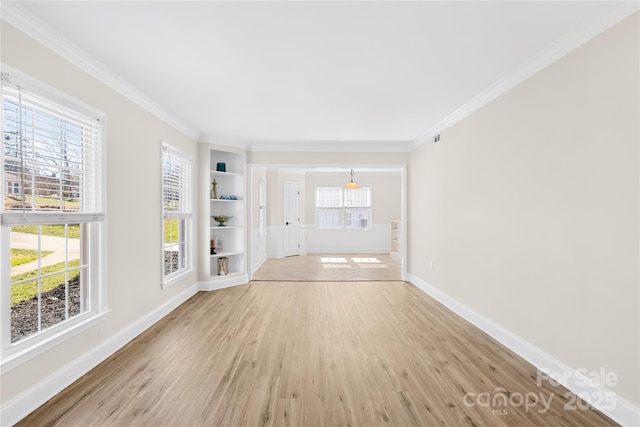 1133 Bloom Wood Ln, Matthews, NC 28105 - spare room with a healthy amount of sunlight, light wood finished floors, and ornamental molding