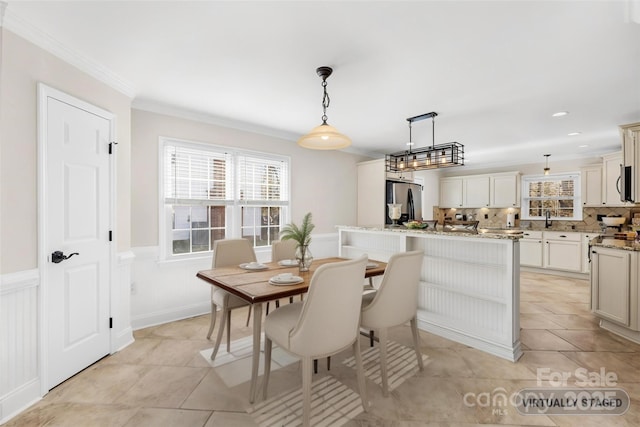 1133 Bloom Wood Ln, Matthews, NC 28105 - dining room with recessed lighting, crown molding, a wainscoted wall, and light tile patterned floors