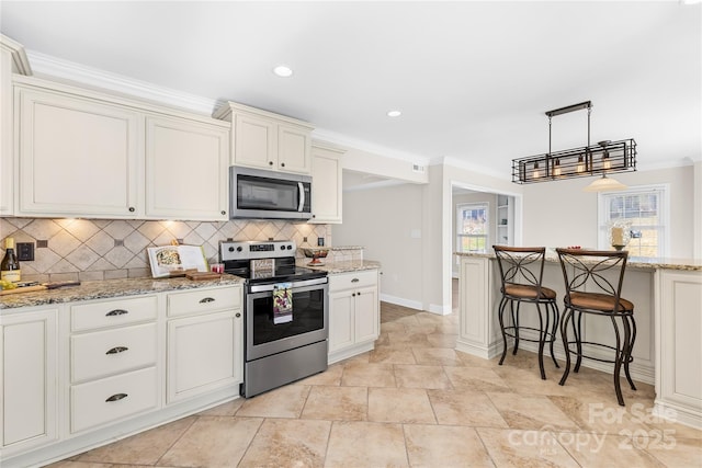 1133 Bloom Wood Ln, Matthews, NC 28105 - kitchen with a kitchen breakfast bar, stainless steel appliances, ornamental molding, baseboards, and decorative backsplash