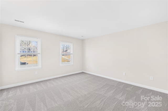 1133 Bloom Wood Ln, Matthews, NC 28105 - empty room featuring baseboards, visible vents, and carpet