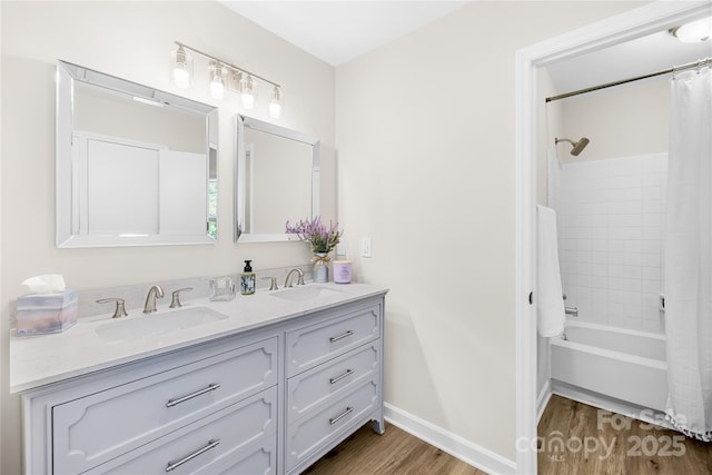 1133 Bloom Wood Ln, Matthews, NC 28105 - full bath with wood finished floors, double vanity, and shower / bath combo