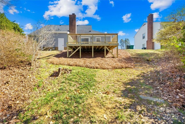 1133 Bloom Wood Ln, Matthews, NC 28105 - back of property with a deck and a chimney