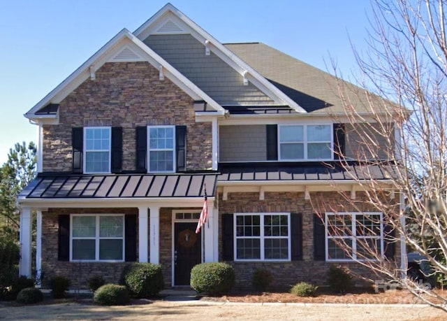 craftsman-style house with a standing seam roof and metal roof