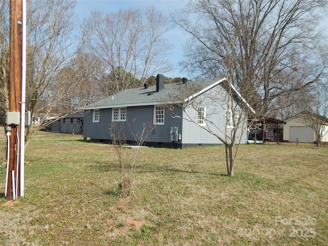 view of home's exterior with a yard