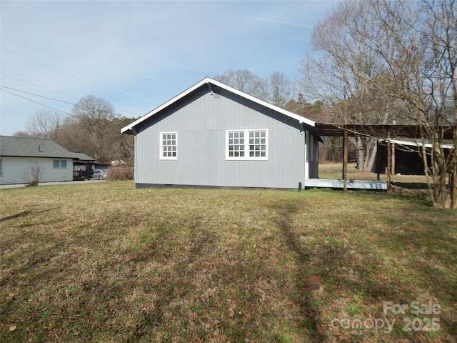 back of property with a lawn