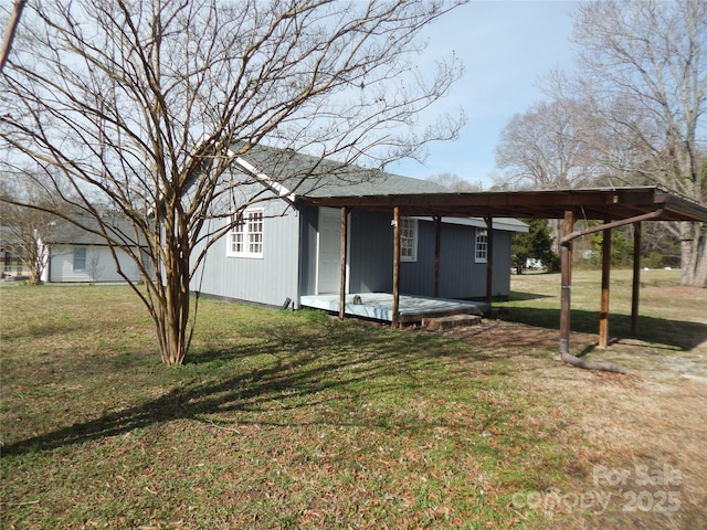 view of outbuilding featuring a yard