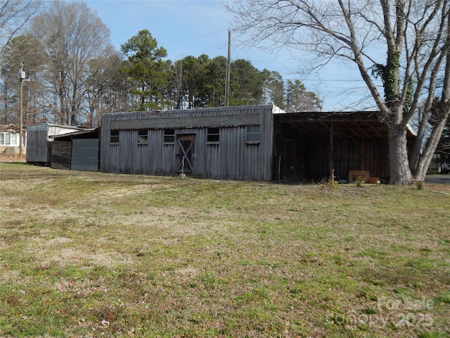 view of outdoor structure with a lawn