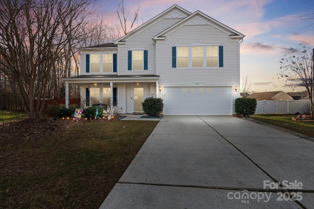 front of property with a porch and a garage