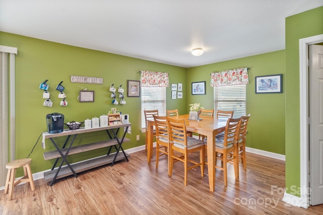 dining area with light hardwood / wood-style flooring