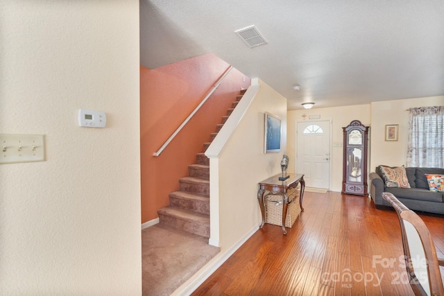 foyer entrance with wood-type flooring