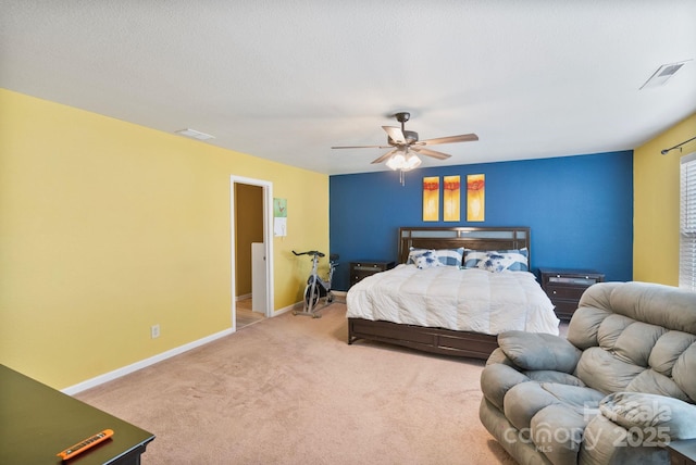 carpeted bedroom featuring a textured ceiling and ceiling fan