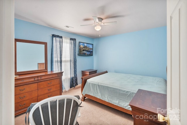 bedroom with ceiling fan and light colored carpet