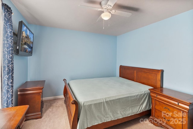 bedroom featuring ceiling fan and light colored carpet