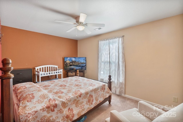 bedroom with light carpet and ceiling fan