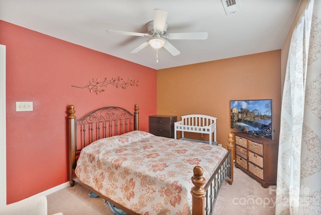 bedroom featuring ceiling fan and light carpet