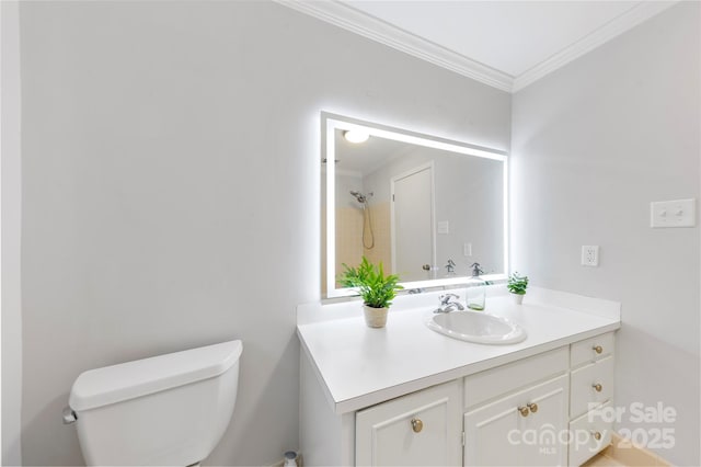 bathroom featuring vanity, toilet, and ornamental molding