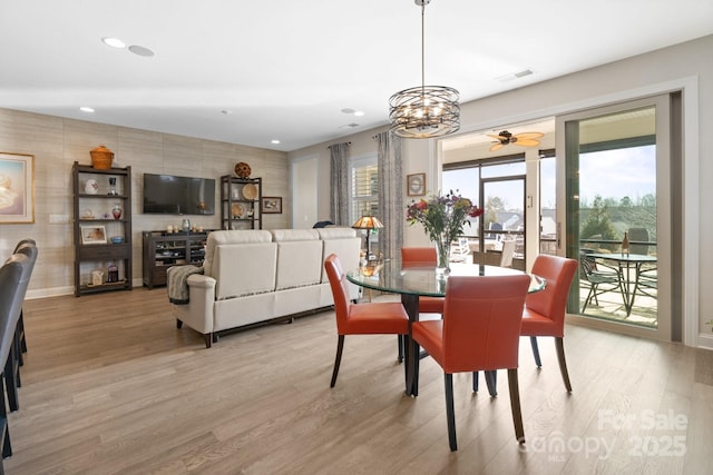 dining area with light wood-type flooring, visible vents, baseboards, and recessed lighting