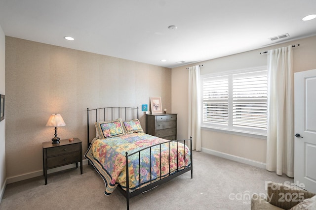 carpeted bedroom with recessed lighting, visible vents, and baseboards