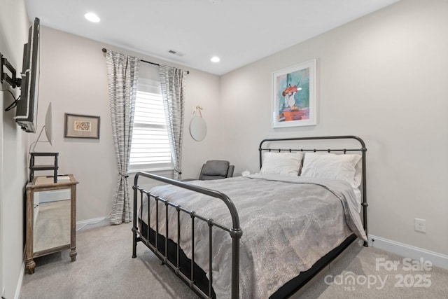 carpeted bedroom with visible vents, baseboards, and recessed lighting