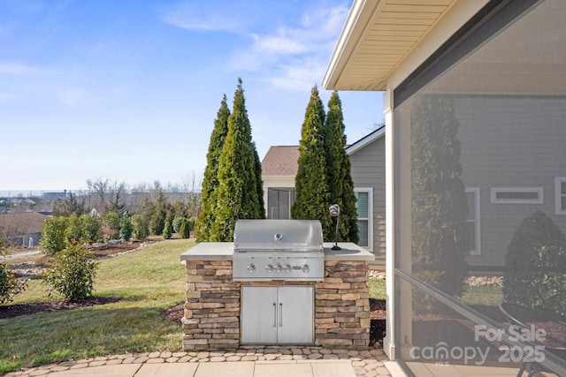 view of patio / terrace featuring exterior kitchen and grilling area