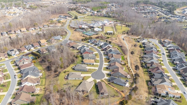 birds eye view of property with a residential view