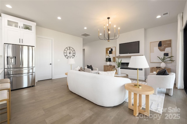 17201 Green Hill Rd, Charlotte, NC 28278 - living area with baseboards, visible vents, wood finished floors, and recessed lighting
