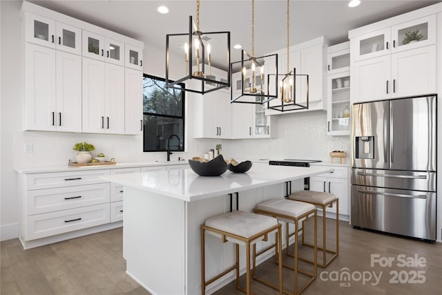 17201 Green Hill Rd, Charlotte, NC 28278 - kitchen with a sink, a chandelier, a center island, recessed lighting, and stainless steel fridge
