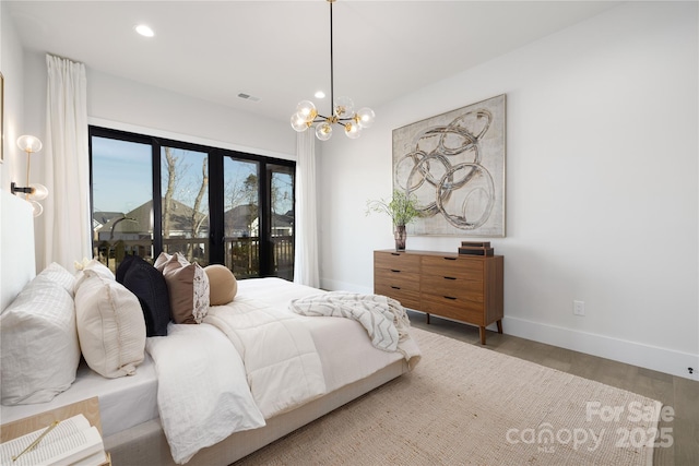 17201 Green Hill Rd, Charlotte, NC 28278 - bedroom featuring visible vents, baseboards, recessed lighting, wood finished floors, and a notable chandelier