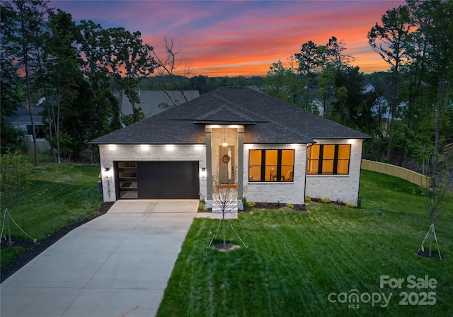 17201 Green Hill Rd, Charlotte, NC 28278 - prairie-style house with a garage, brick siding, a yard, roof with shingles, and concrete driveway