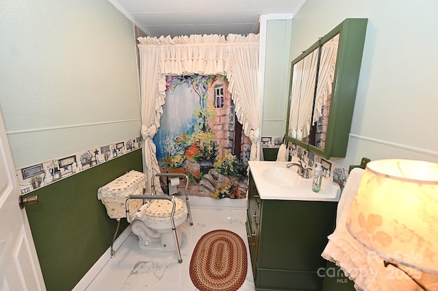 bathroom featuring toilet and vanity