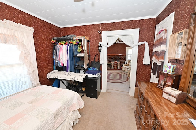 carpeted bedroom featuring crown molding